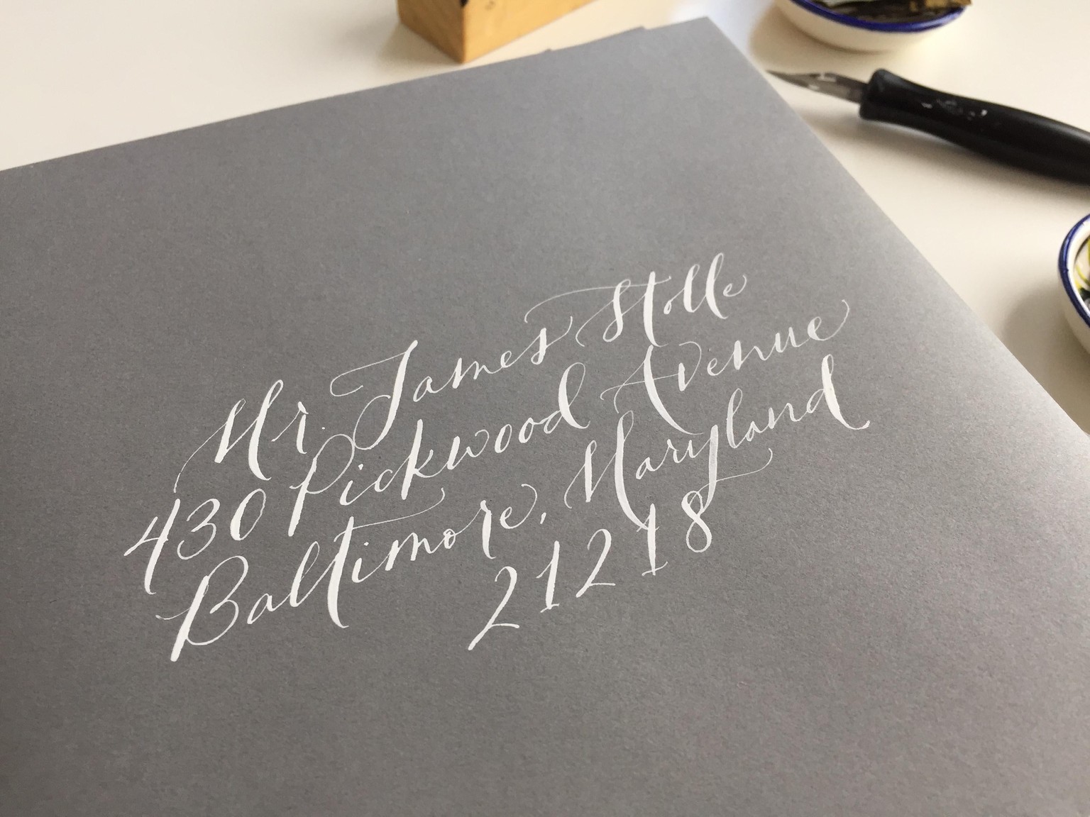 white ink on grey envelopes - image 2 - student project