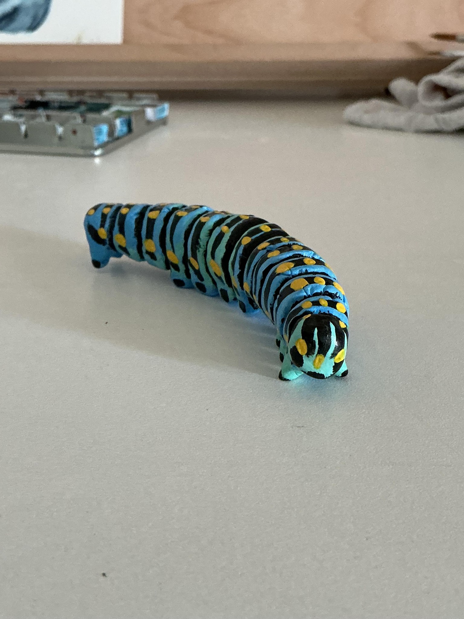 Air-dry clay caterpillar - image 1 - student project