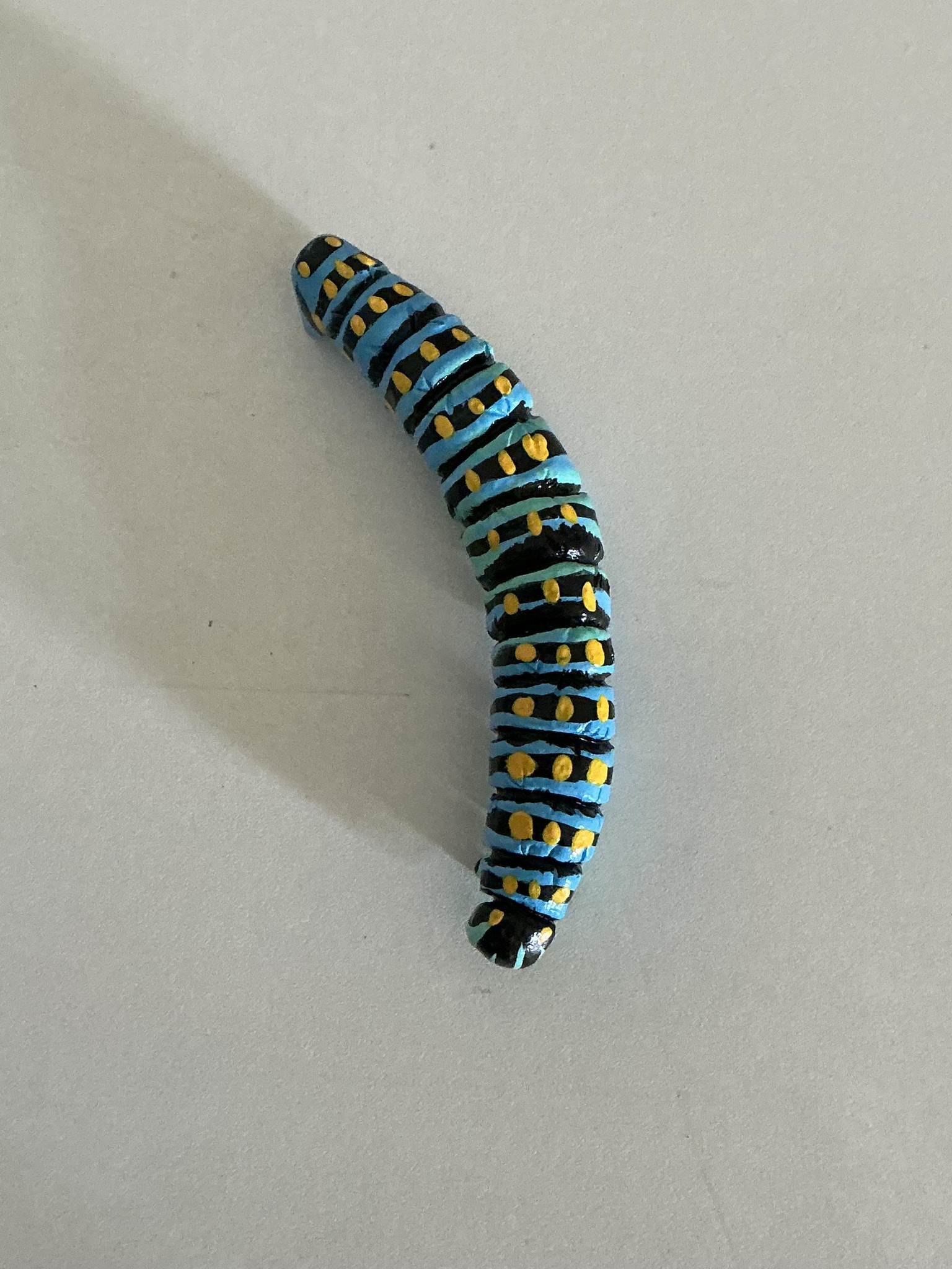 Air-dry clay caterpillar - image 2 - student project