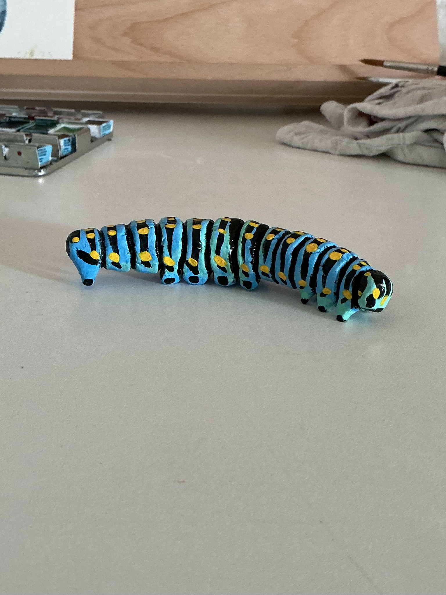 Air-dry clay caterpillar - image 3 - student project