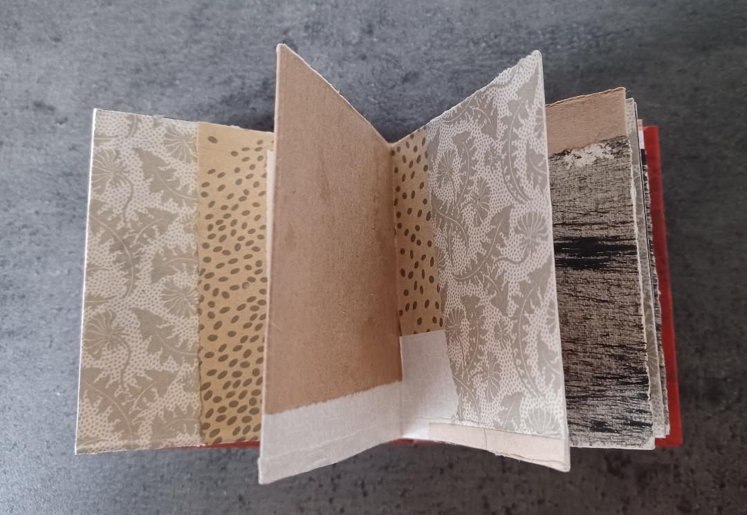 Mini folded book with collage paper and old stamps - image 2 - student project