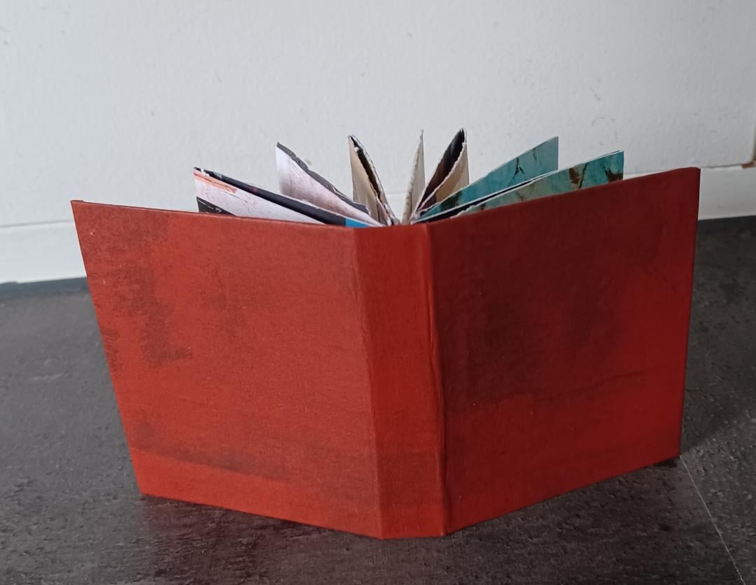 Mini folded book with collage paper and old stamps - image 1 - student project
