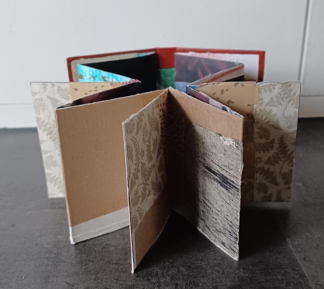 Mini folded book with collage paper and old stamps - image 3 - student project