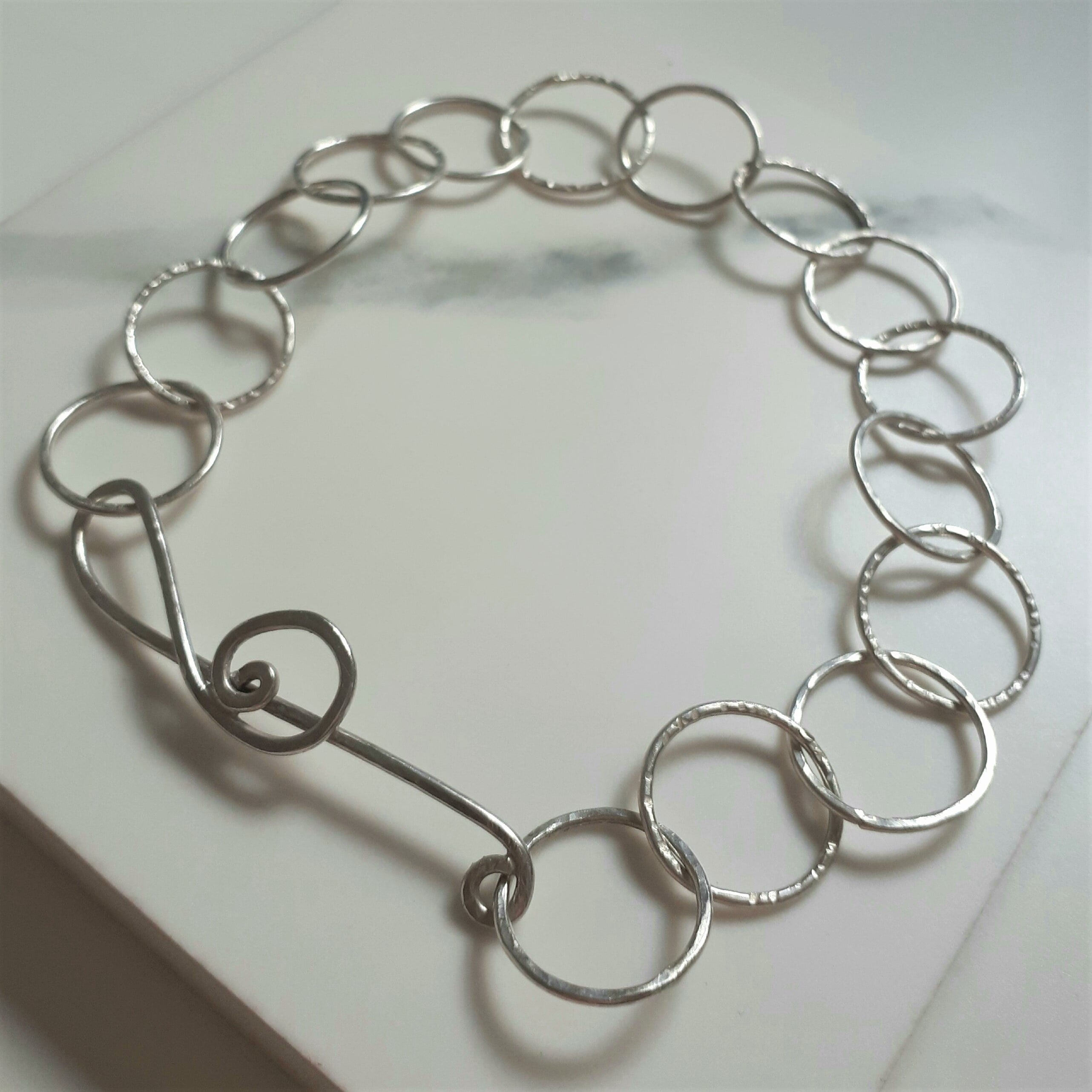 Treble clef hammered bracelet - student project