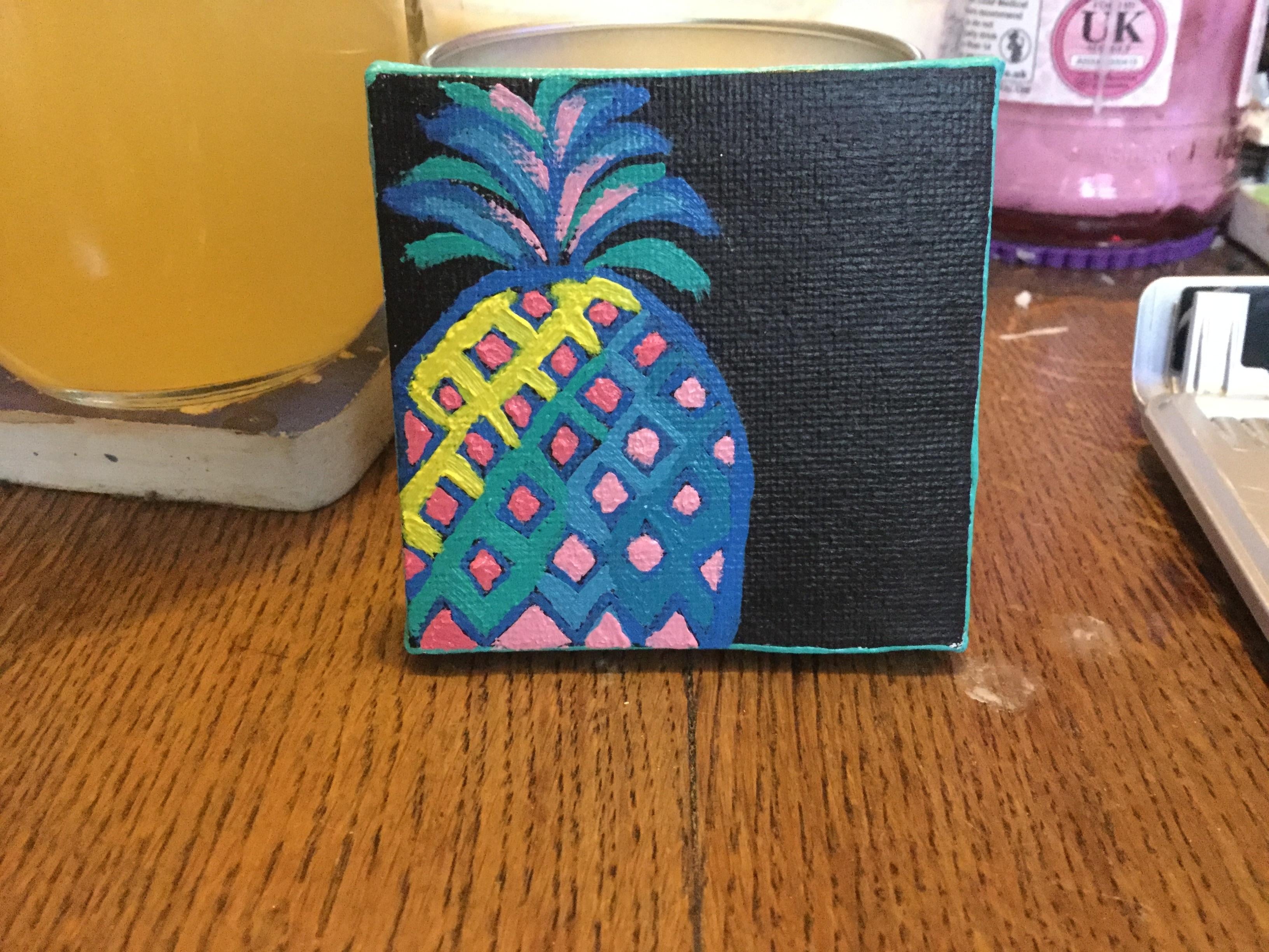 Painting a colourful pineapple - student project