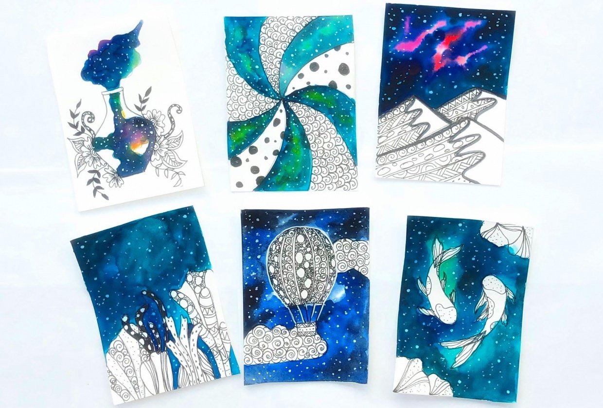 Ink and watercolor galaxy doodles - student project