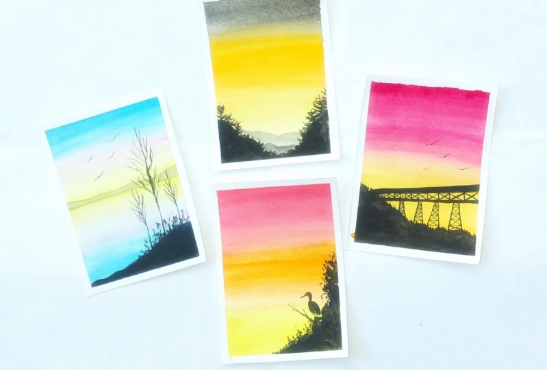 Watercolor sunset and silhouettes