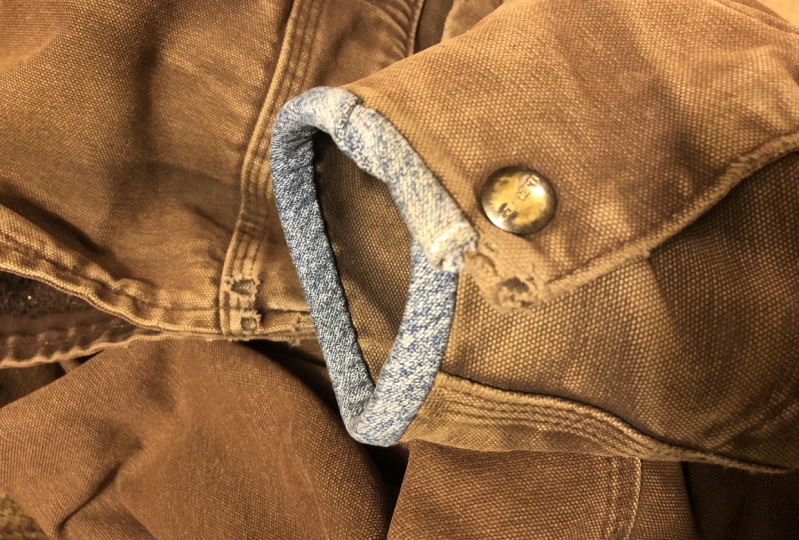 Mended jacket using the felling stitch