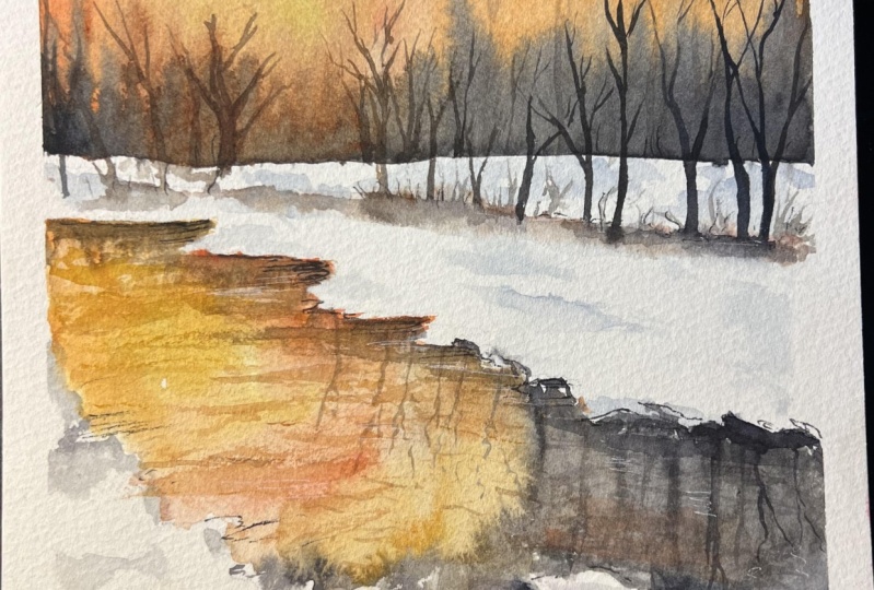 Sunset on snowy land