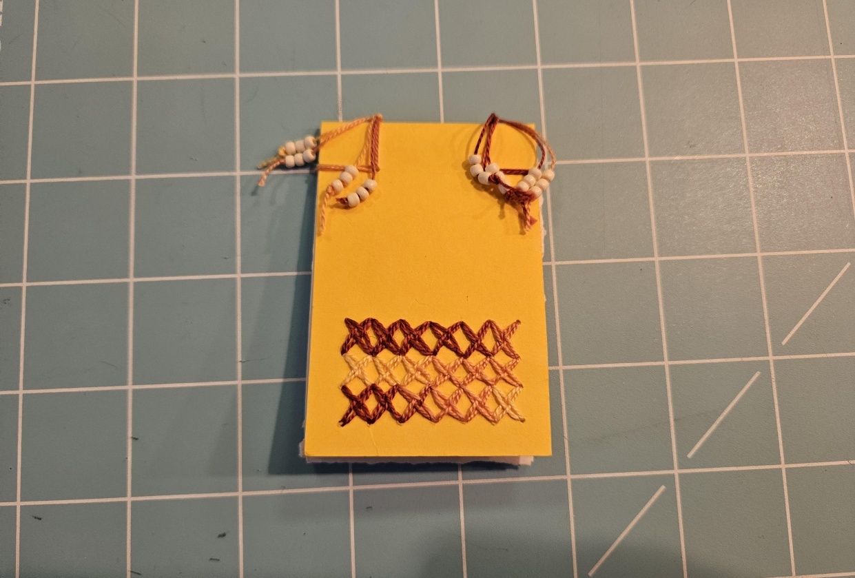 Ledger Book with beads - student project