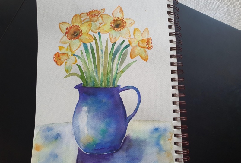 Daffodils in a blue jug