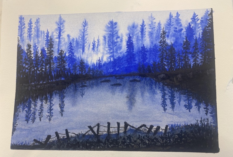 Misty blue trees and lake