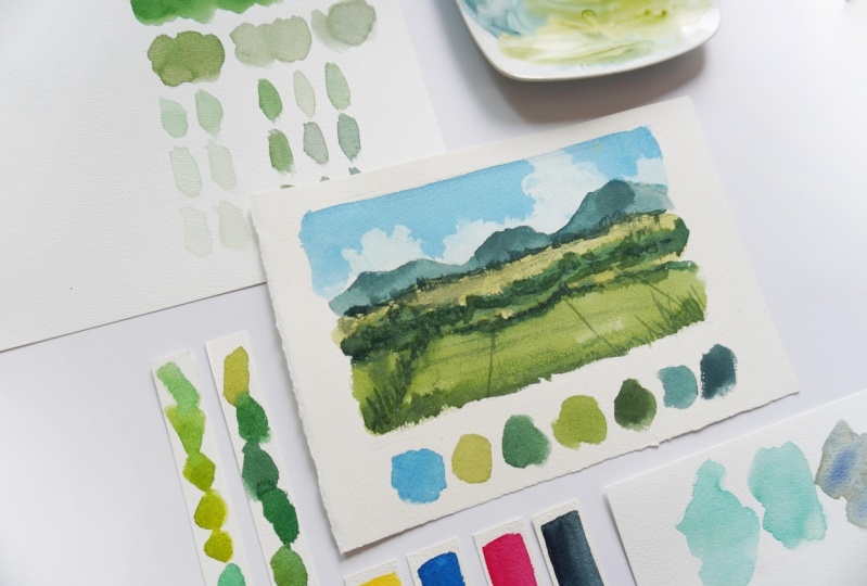 Mixing different shades of watercolor greens