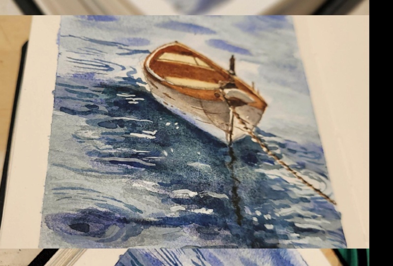 Bote y reflejos en el agua