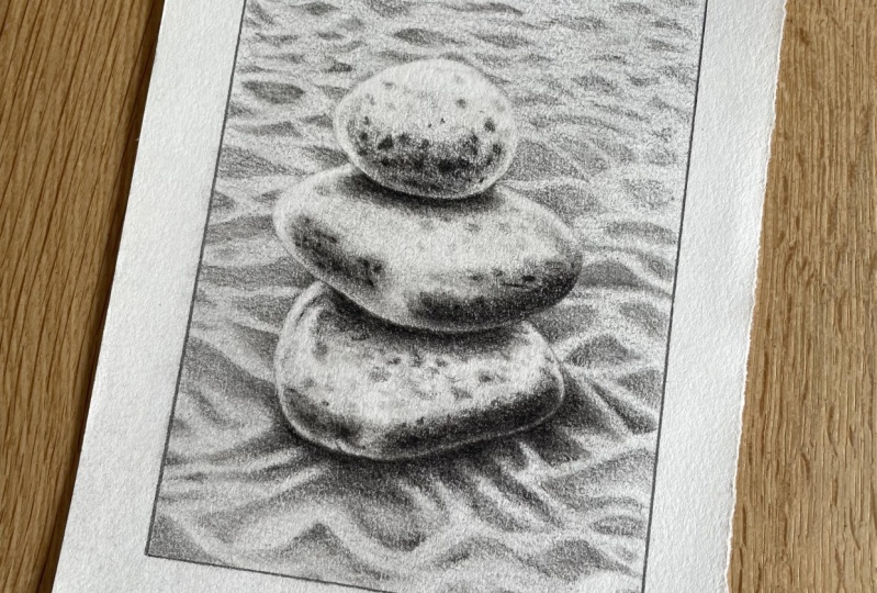 Rocks in sand with charcoal pencil