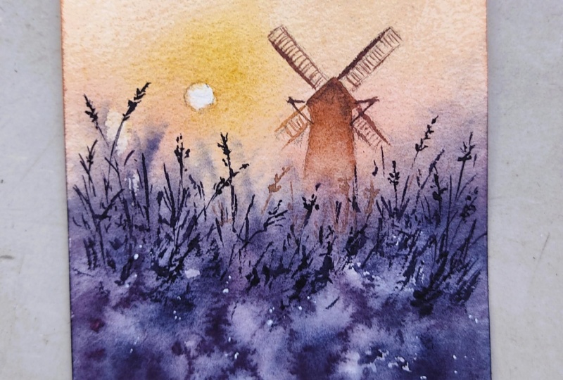 Atmospheric Windmill Scene with Golden Sun & Blue Mist