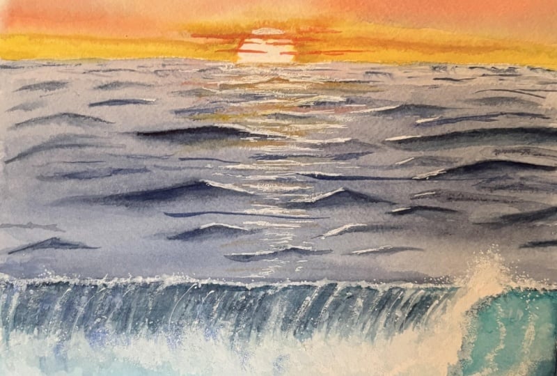 Sunset with crashing wave