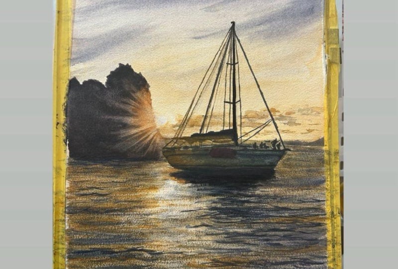 Glowing sunset and sailboat